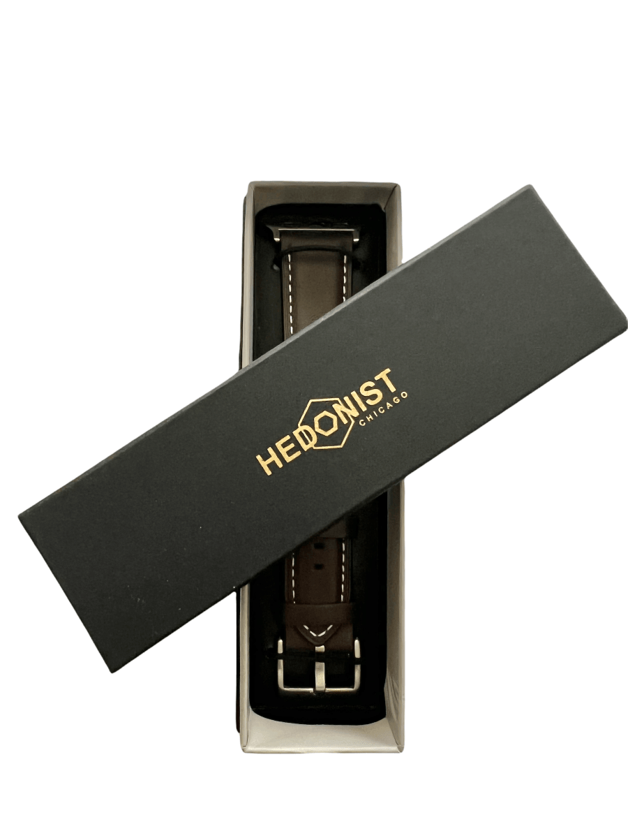 Dark brown Apple Watch band packaged in Hedonist Chicago gift box