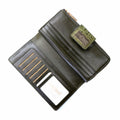 Interior of green leather women’s long travel wallet with 19 card slots, ID window and bill compartments