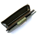 Top view of green leather long women’s travel wallet interior with multiple slots and zip compartments