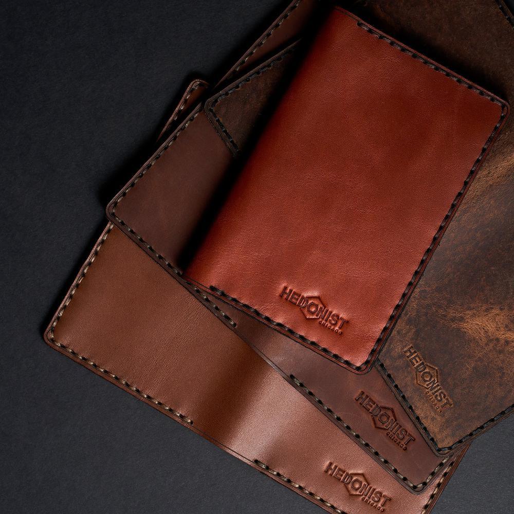 Handmade tan pull-up leather card holder, 12 card slots fanned out view