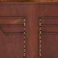 Handmade whisky pull-up leather bifold wallet, close-up of leather texture and stitching